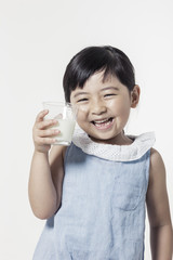 Pretty asian girl hand holding a cup of milk with smile isolated white.