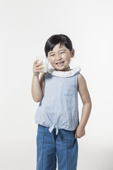 Pretty asian girl hand holding a cup of milk with smile isolated white.