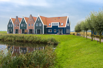 Fototapeta na wymiar Volendam is a town in North Holland in the Netherlands. Colored houses of marine park in Volendam. North Holland, Netherlands..