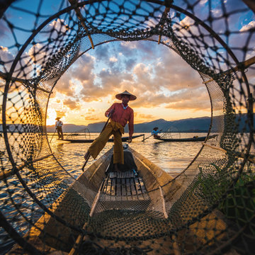 Inle Lake Intha fishermen at sunset in Myanmar (Burma).
