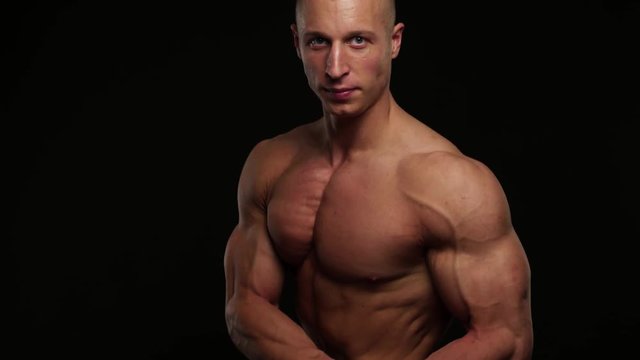 bodybuilder posing in studio