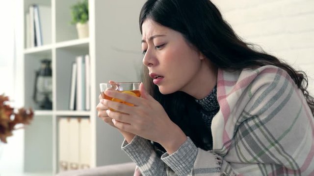 women caught cold and drinking hot lemon tea