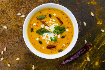Delicious hot and spicy Thai pumpkin cream soup.