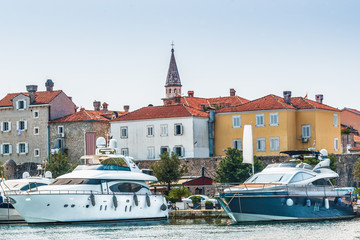  Marina for sailing yachts and boats overlooking the old town off the coast of Budva, Budva Riviera, Montenegro.