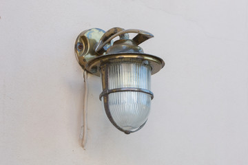 Vintage looking metal lantern with modern lamp