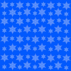 White snowflakes on a blue background.Background for Christmas a