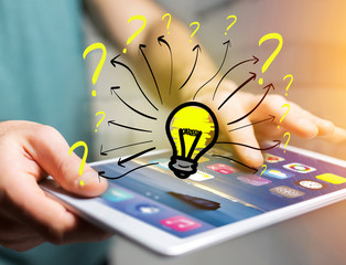 Innovation bulb lamp turned on displayed on a futuristic interface with question mark - technology...