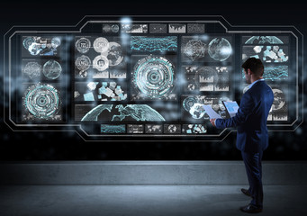 Businessman watching graph screens interface on a rooftop 3D rendering