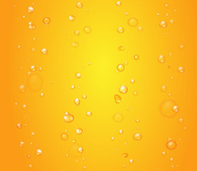 Yellow drops of orange juice or beer bubbles background