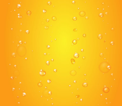 Yellow drops of orange juice or beer bubbles background