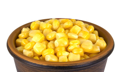 Sweet corn kernels in bowl over white