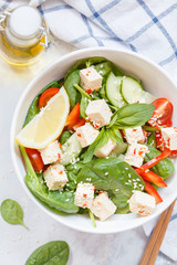 Vegan healthy salad with paprika tofu and vegetables.