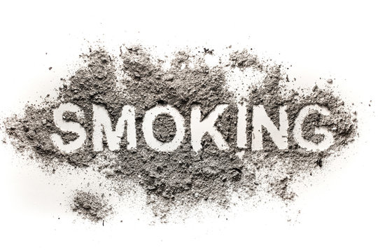 Smoking word written in ash or dust