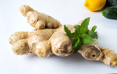 Ginger root with lemons and cucumbers