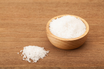 Fototapeta na wymiar Sea salt in wooden bowl