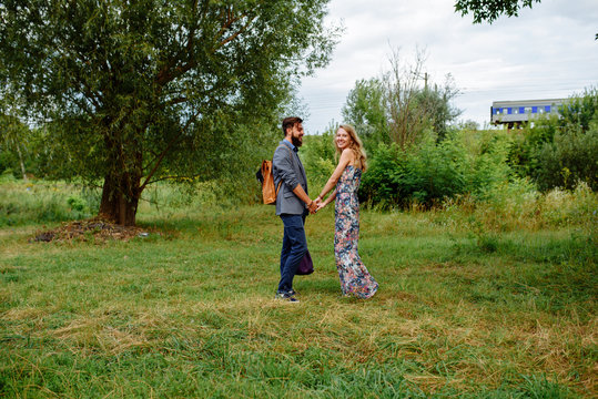 A picture of a young romantic man and woman. Lifestyle portrait of an engaged couple that loves the outdoors
