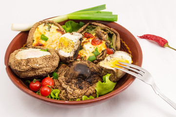 egg and cheese stuffed mushrooms on a plate