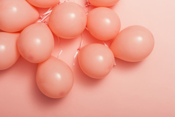 pink balloon on the pink color paper background.