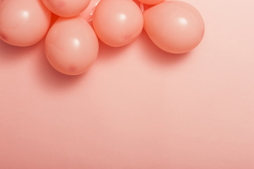 pink balloon on the pink color paper background.