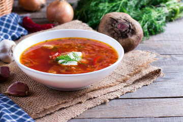 Ukrainian borscht red soup in a bowl on the table