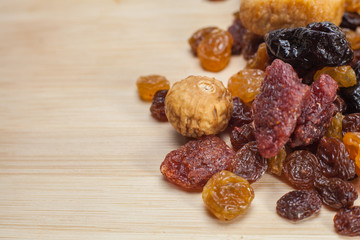 Dried fruit mix on wooden background  with copy space