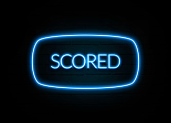 Scored  - colorful Neon Sign on brickwall