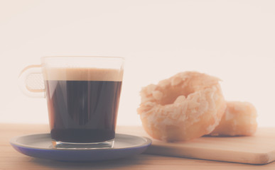 Cup of espresso and doughnut bakery.