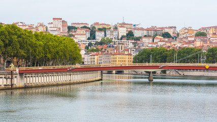 Vieux-Lyon, colorful houses and footbridge in the center, on the river Saone 
