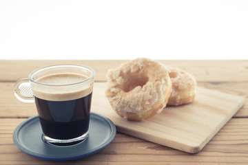 Cup of espresso and doughnut bakery.