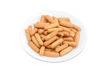 Cookies in the form of sticks on a white dish