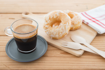 Cup of espresso and doughnut bakery.