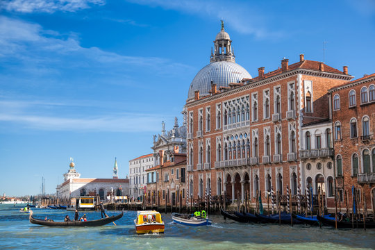 Grand Canal with gondola and boats in Venice, Italy