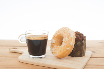 Cup of espresso and doughnut bakery.