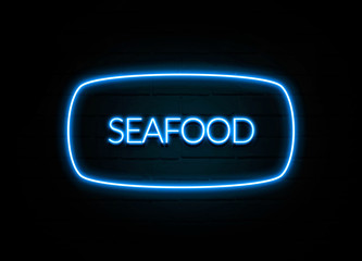 Seafood  - colorful Neon Sign on brickwall