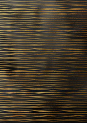 Crumped black paper background with gold line pattern