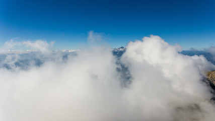 Aerial flying above clouds.