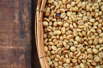 Close up of coffee beans on wooden background
