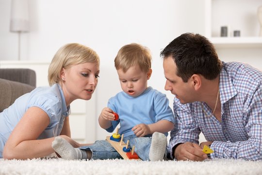 Caucasian family playing together at home