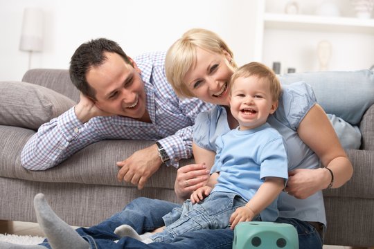 Parents laughing with baby