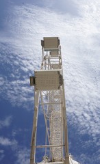 Big wheel with blue sky and clouds