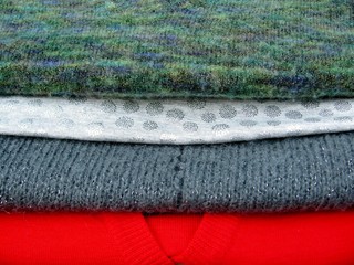 Stack of  colorful Christmas warm winter clothes