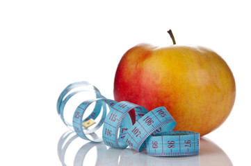 blue measure tape and red apple  isolated