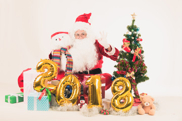 Happy merry Christmas Santa Claus pointing holding Gift Box with Isolated on white background.