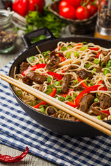 Chinese pasta with beef. Prepared in wok.