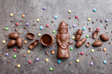 Delicious Christmas chocolate and sweets on rustic background