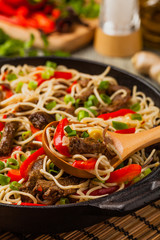 Chinese pasta with beef. Prepared in wok.