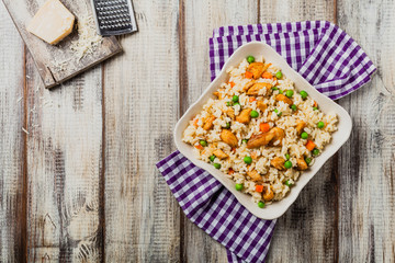 Delicious risotto with chicken and green peas.