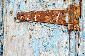 morocco in  old wood  facade home and rusty safe padlock