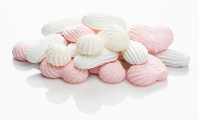 pink and white meringue cake on white background