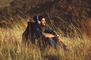 Young hiker enjoys a sunny day on the mountain